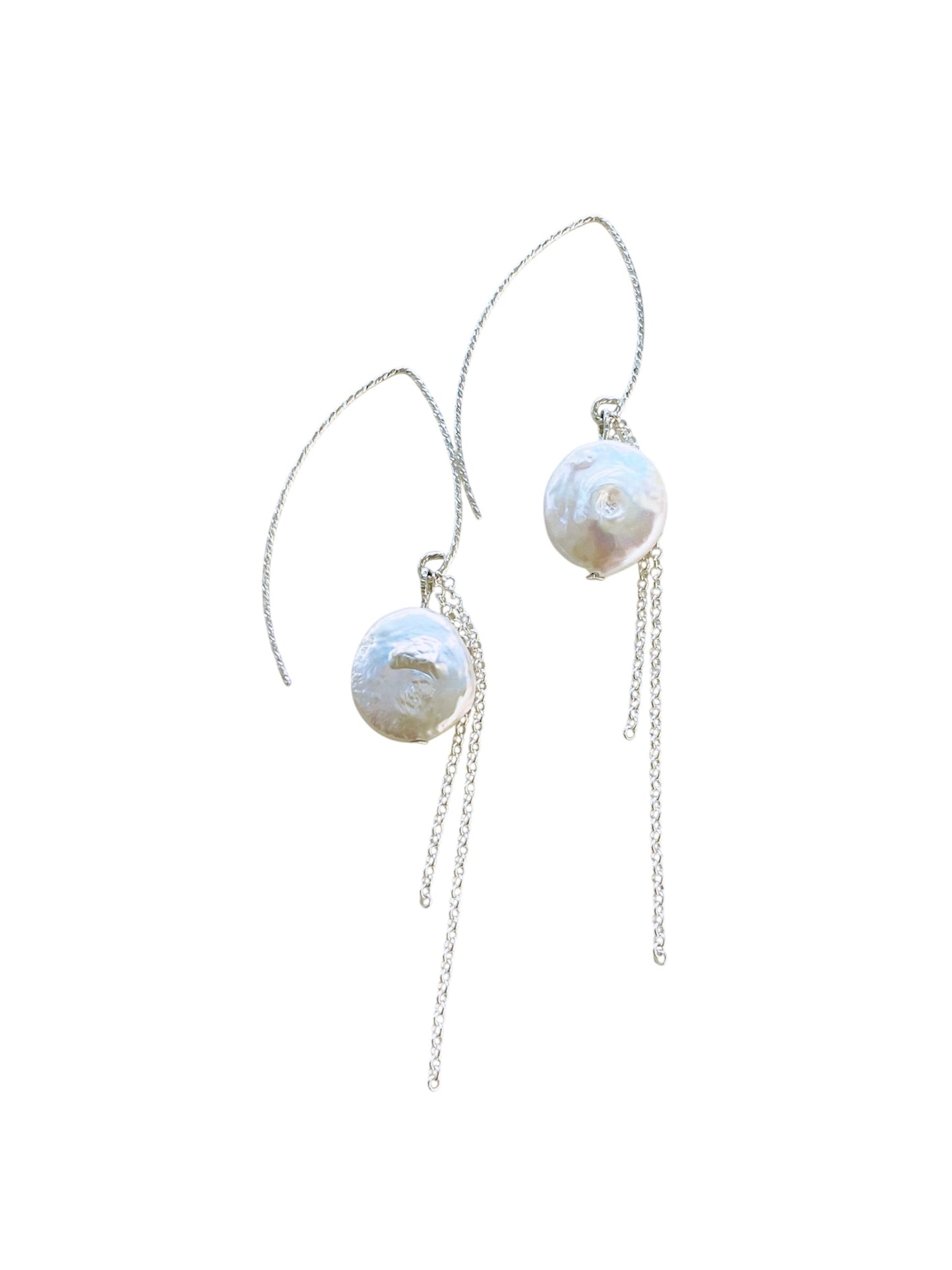 Pearl earrings with silver chains on a white background