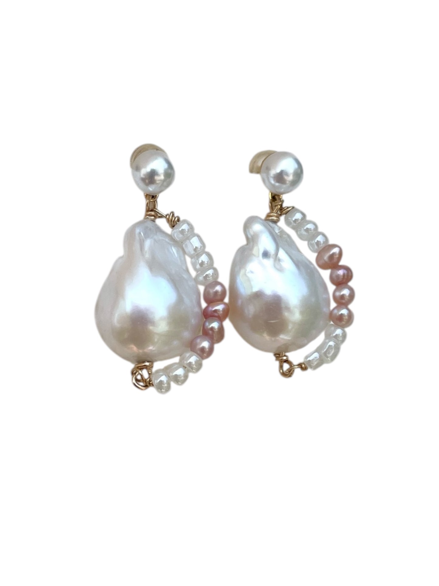 Pair of pearl earrings on a white background