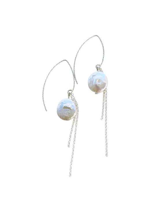Pearl earrings with silver chains on a white background