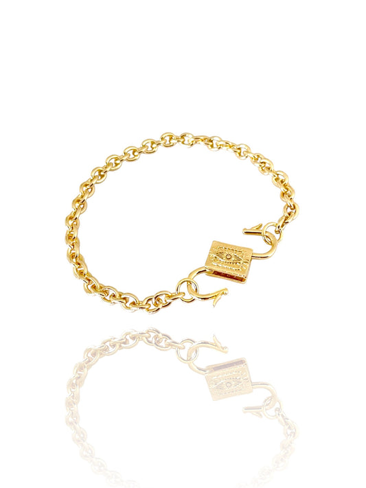 Gold chain bracelet with padlock clasp on a white background