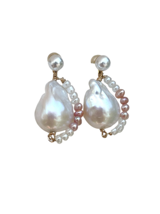 Pair of pearl earrings on a white background