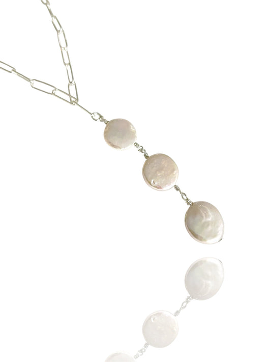 Necklace with round stone pendants on a white background